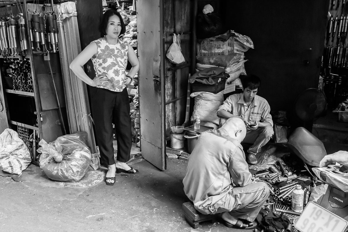 A lady standing with hands on hips while being photographed