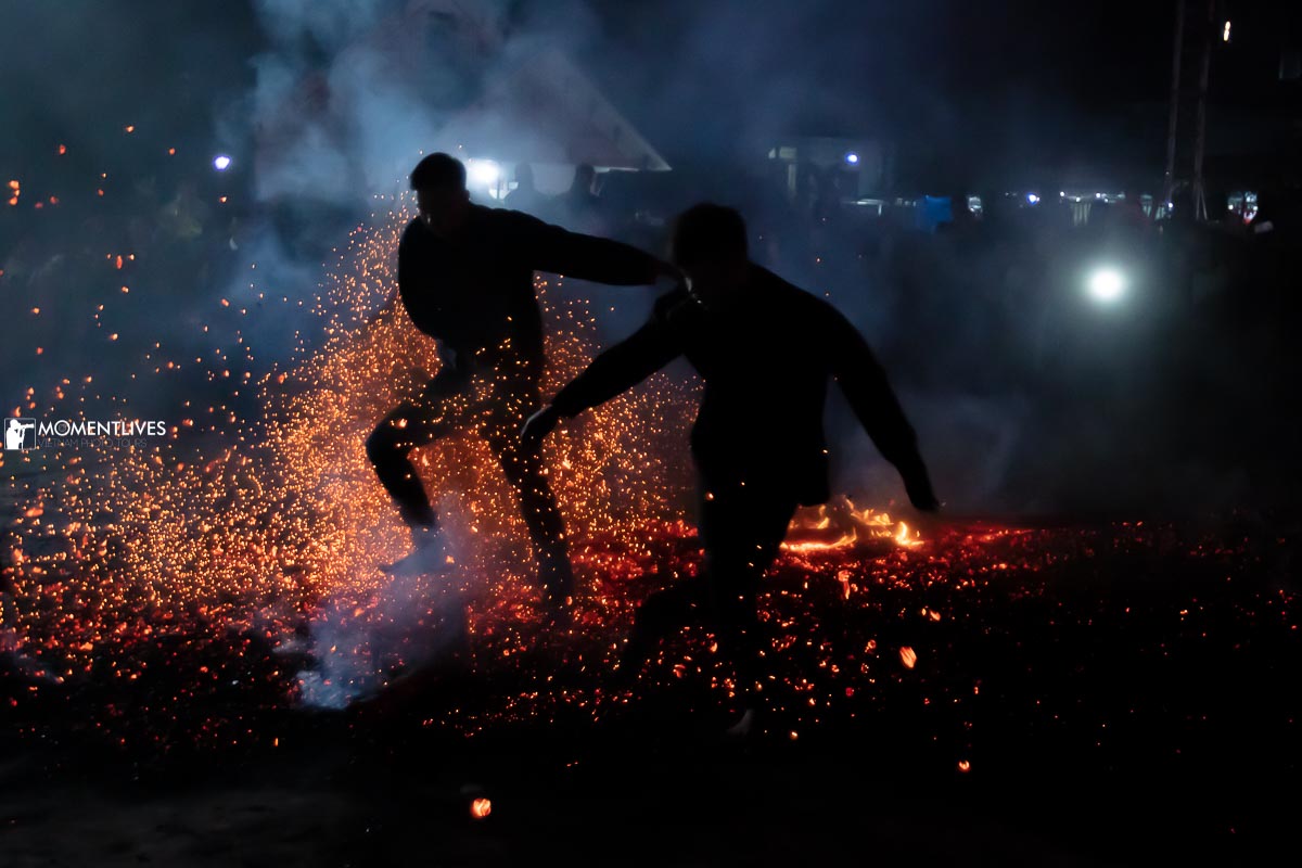 02 man jumping on fire in the fire festival of Ha Giang