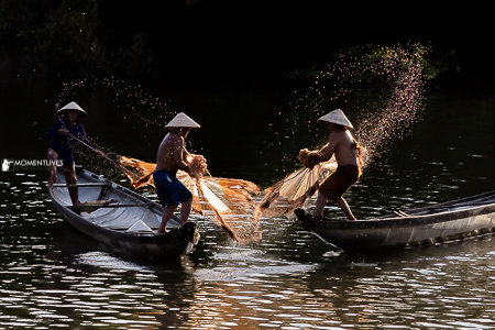 Fishermen casting fishing nets in central Vietnam