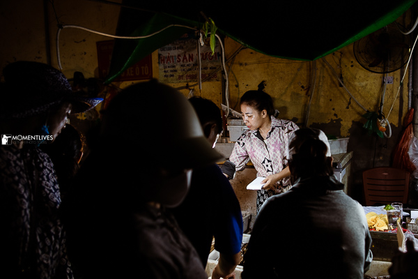A lady selling fish in the market of Long Bien, Hanoi