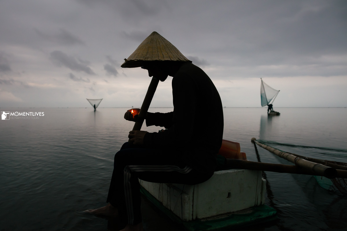 Fisherman smoking on the Infinite Sea of Thai Binh