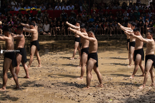 The team of mudball wrestling paying respect to their God