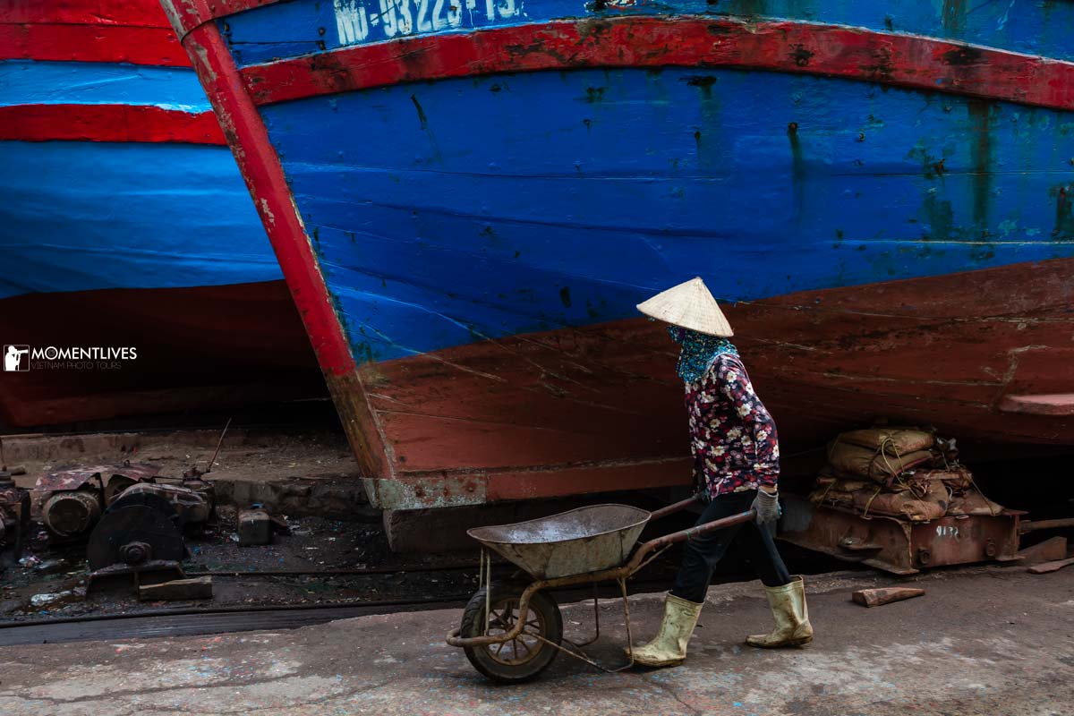 A worker pushing a cart in the shipyard of Nam Dinh