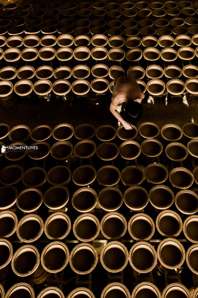 Man sorting out the rubber bowls in Tay Ninh, Vietnam