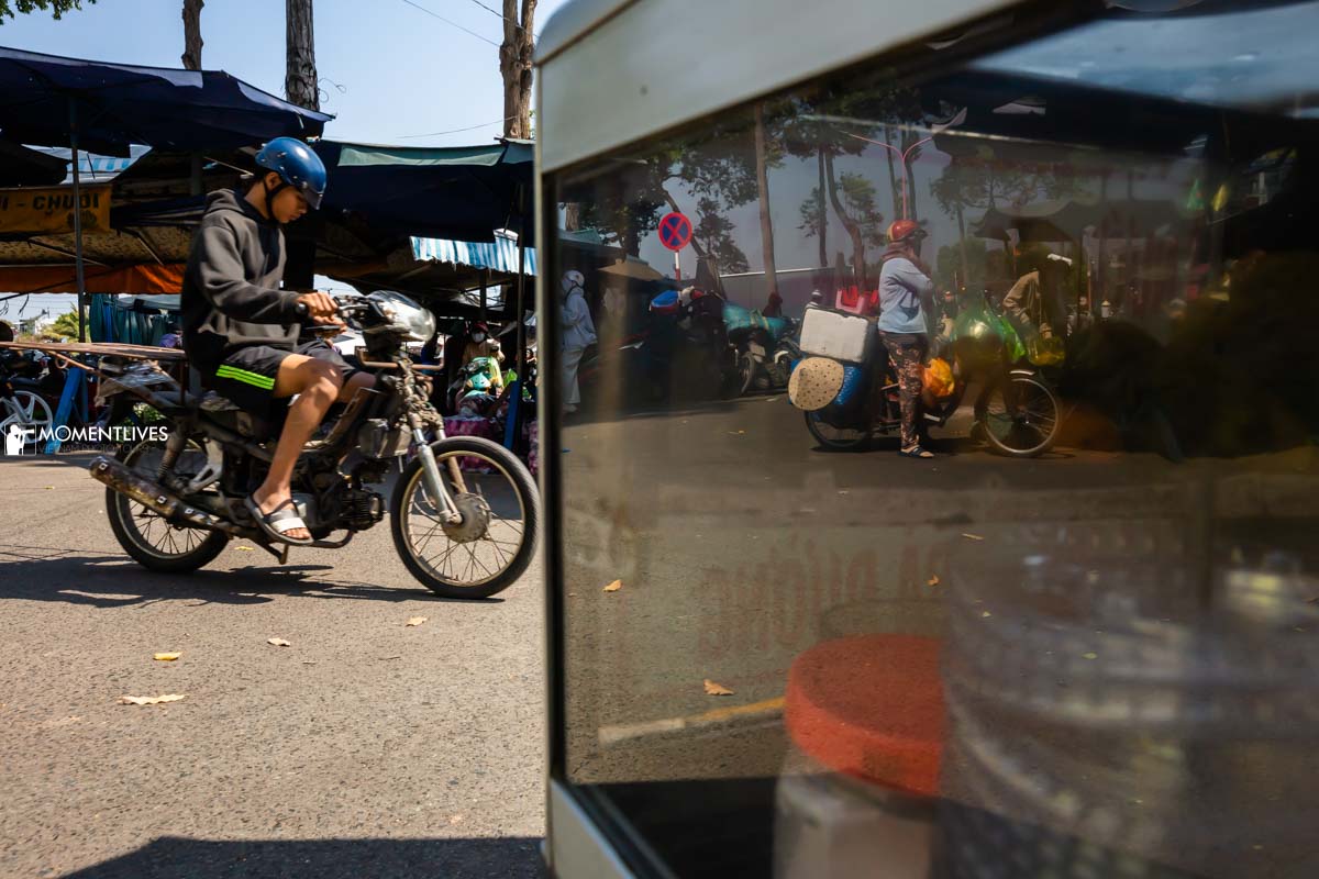 Man riding a scooter in the market of Sa Dec