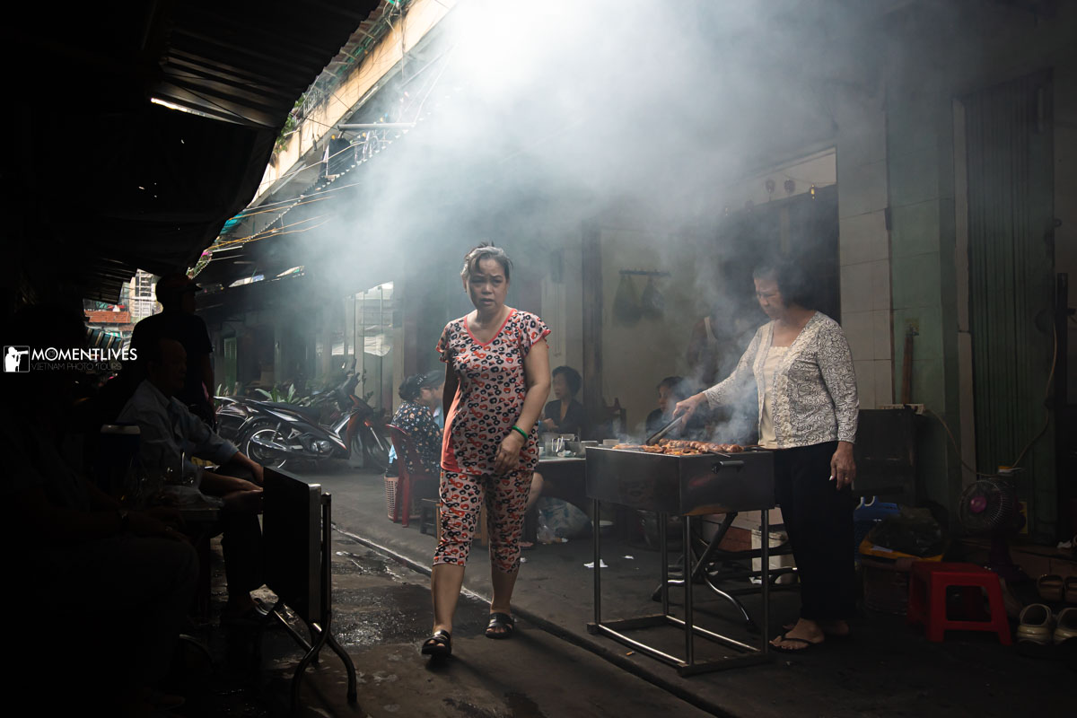 A food stall with rising smoke in Saigon