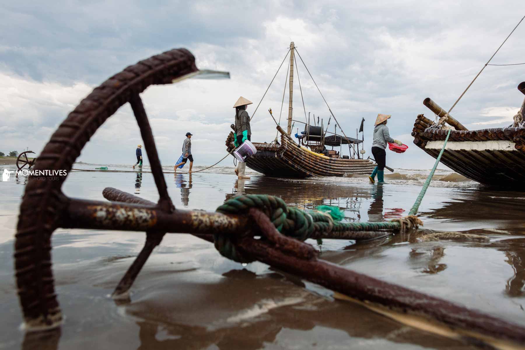 Fishing boats coming to shore in Nam Dinh after a night out fishing