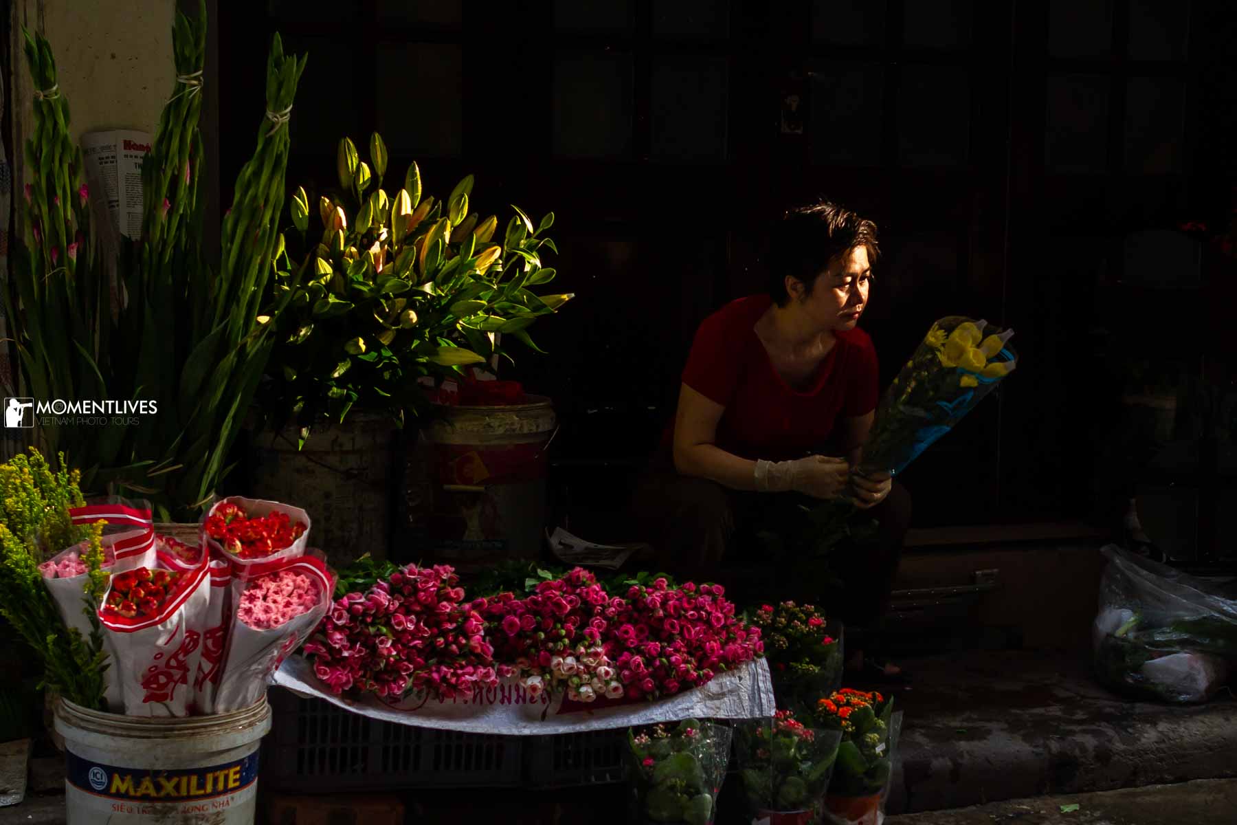A vendor selling flower on the street of Hanoi