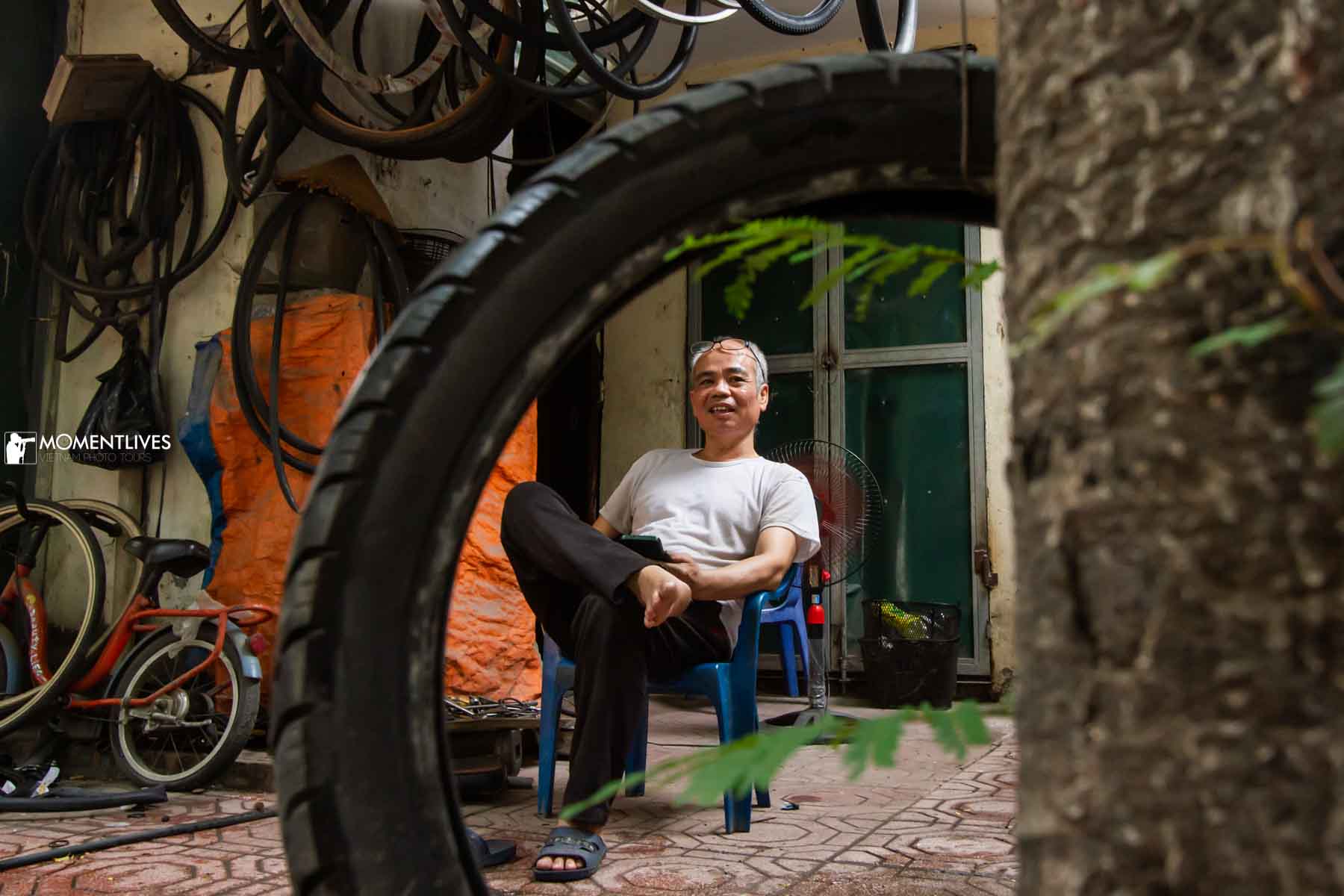 Portrait of a bicycle fixer in Hanoi, Vietnam
